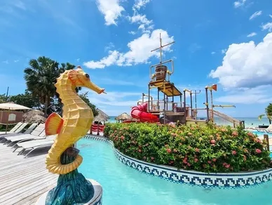 A view of a water park with a sea horse statue.