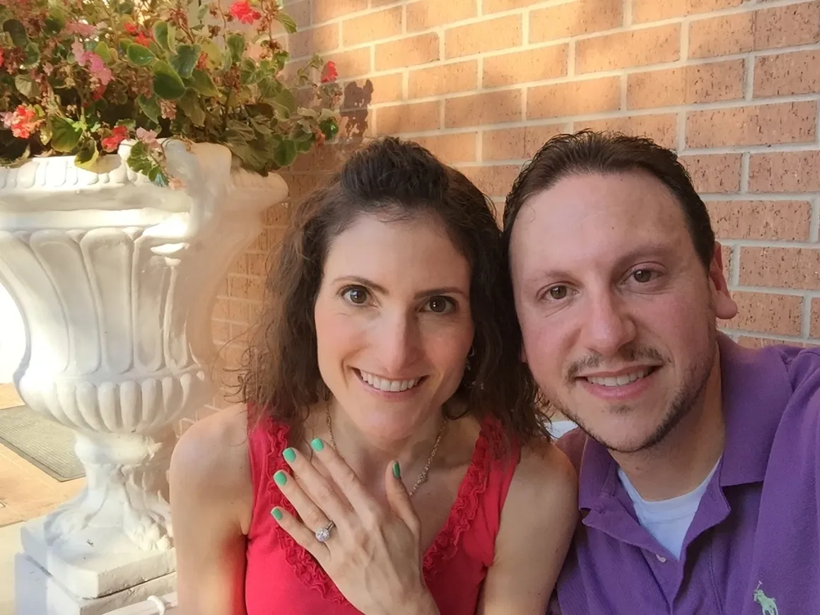 A man and woman posing for a picture.