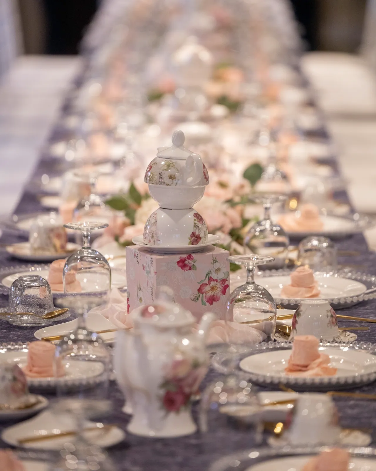 A long table with many plates and cups on it