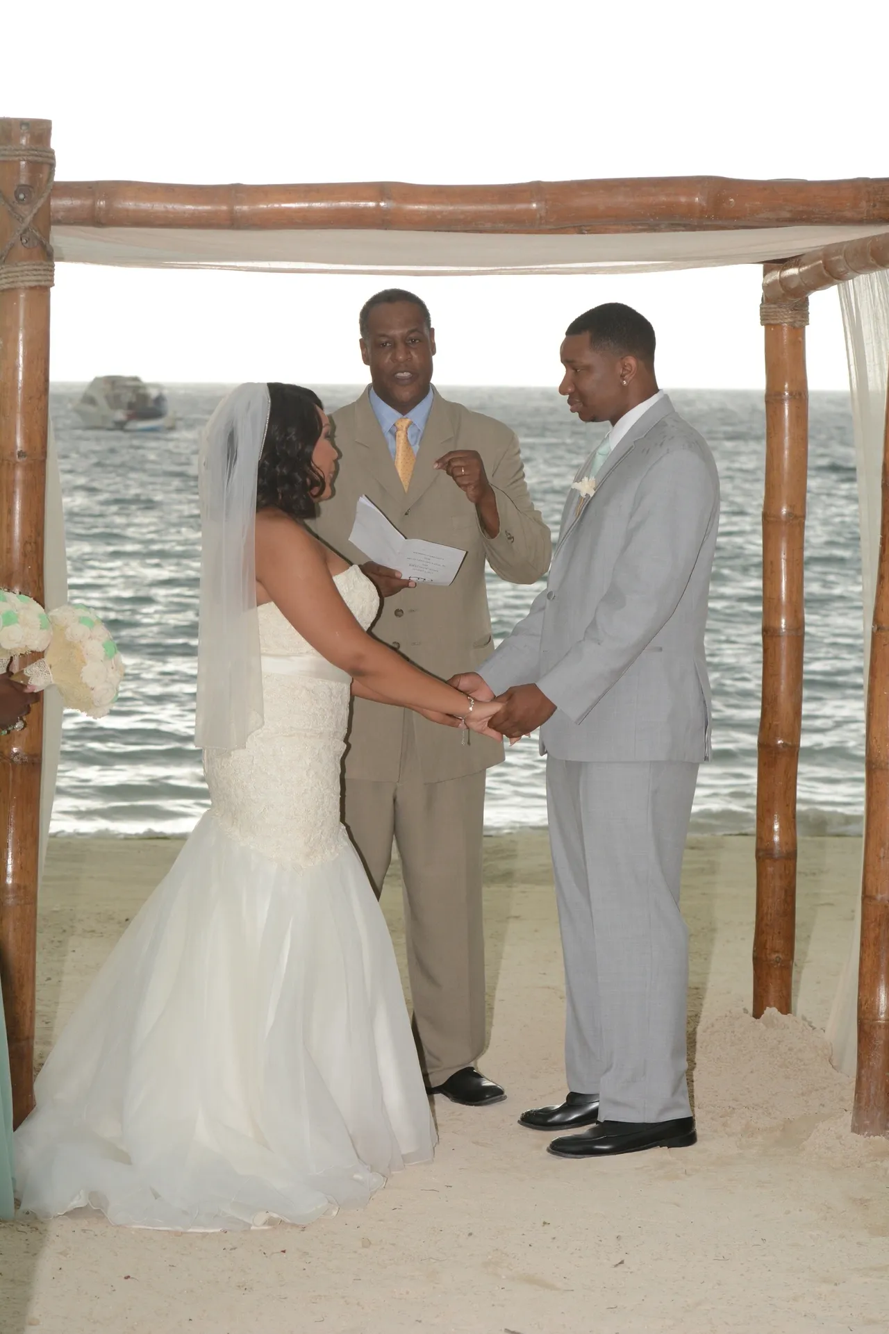 A couple getting married by the water