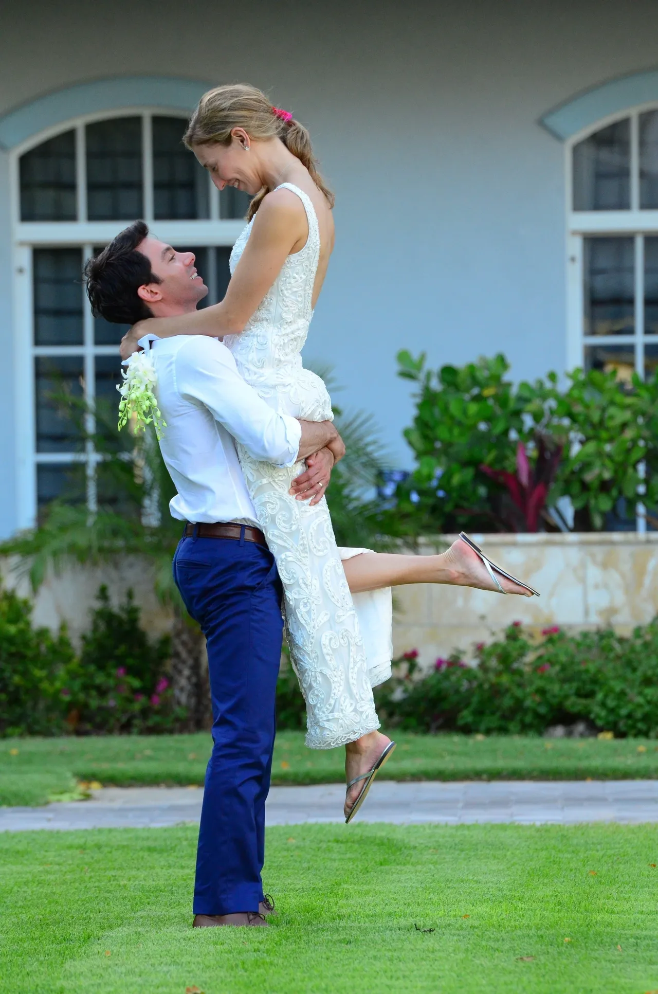 A man holding up a woman in the air.