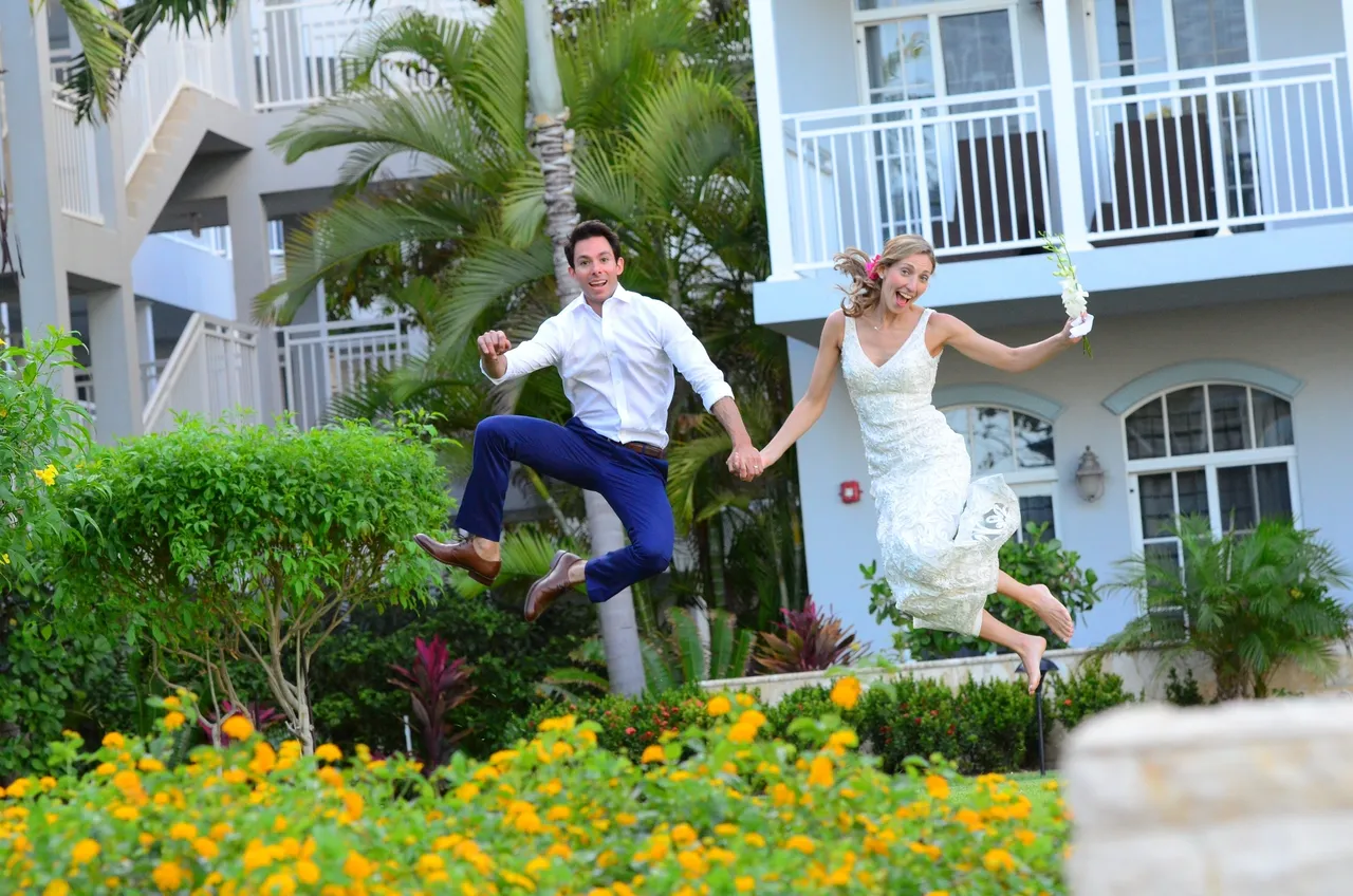 A man and woman jumping in the air