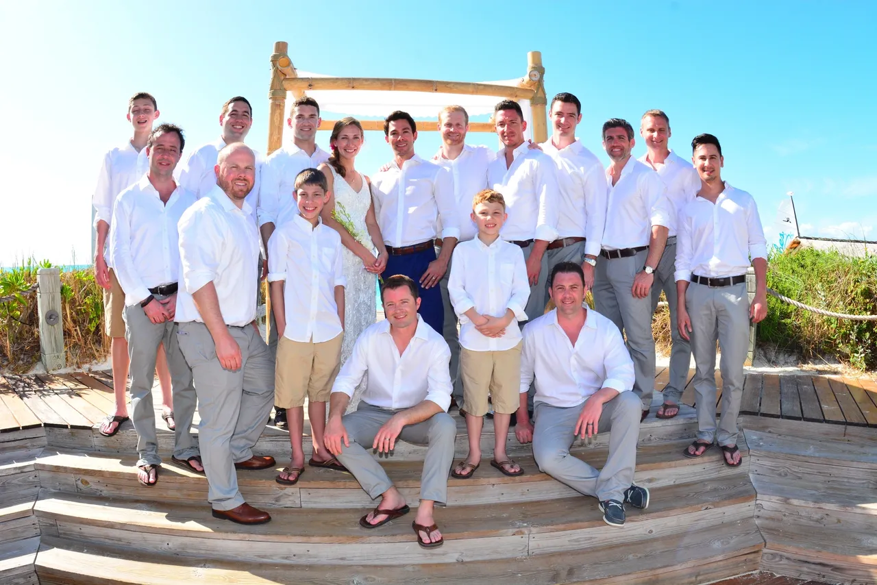 A group of men and women in white shirts.