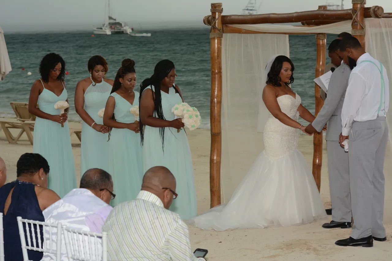 A bride and her bridesmaids at the beach