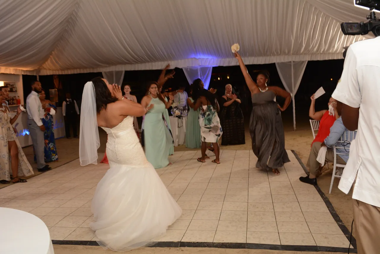 A group of people dancing in front of a crowd.