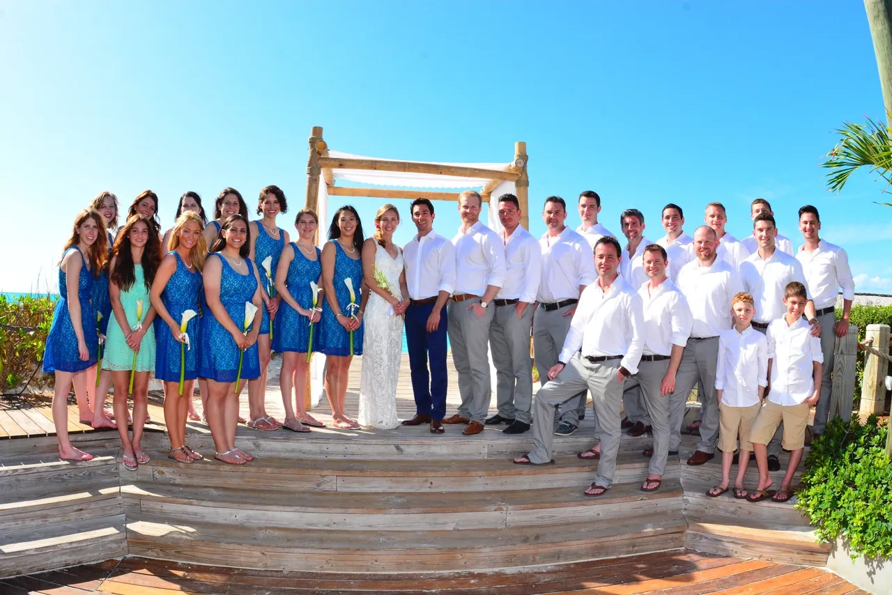 A group of people standing on top of steps.