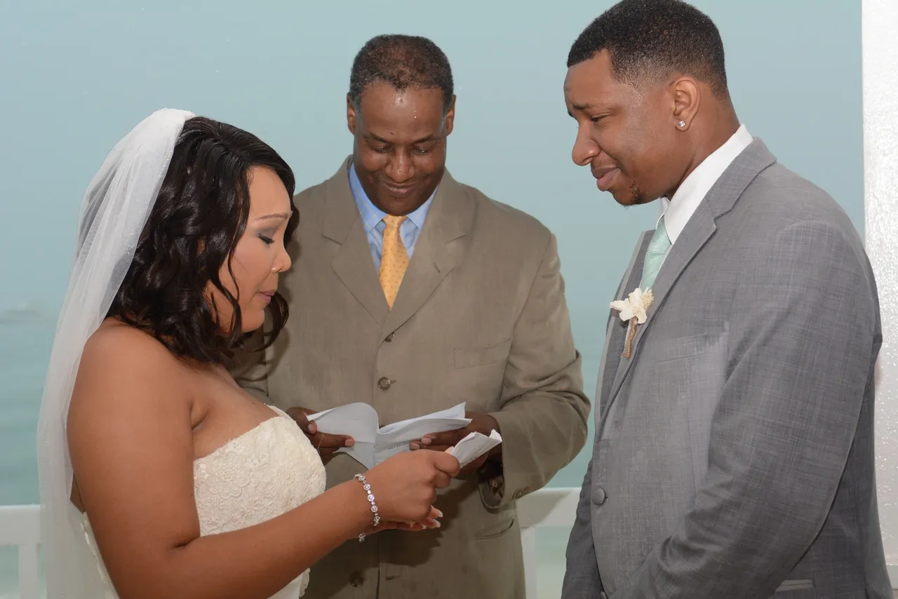 A couple getting married by officiating