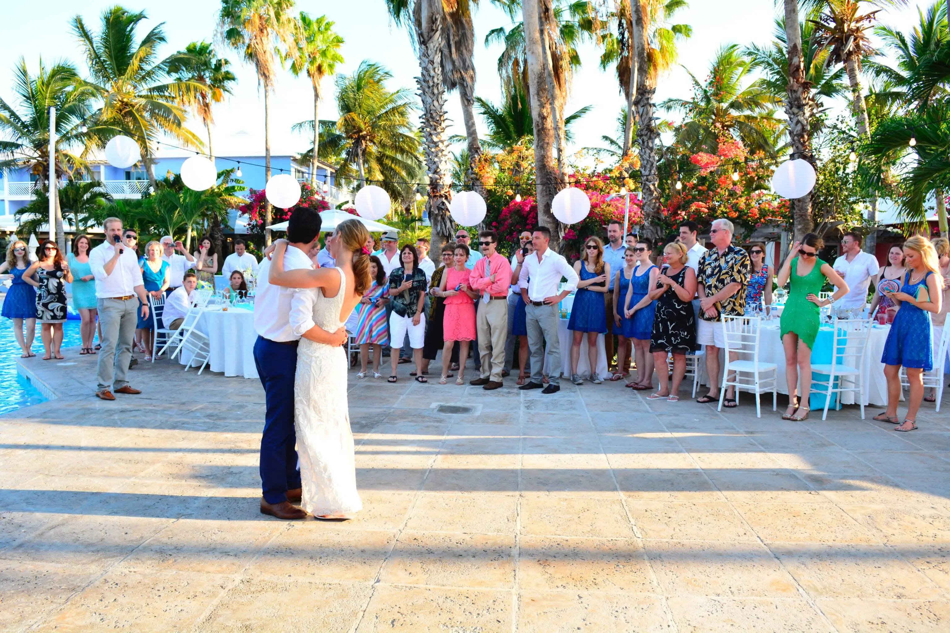 A couple is dancing in front of a crowd.