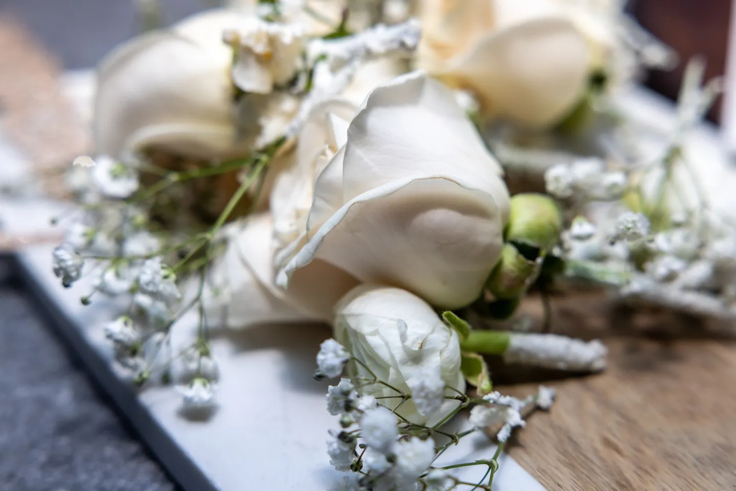 Close up of white roses and baby's breath.