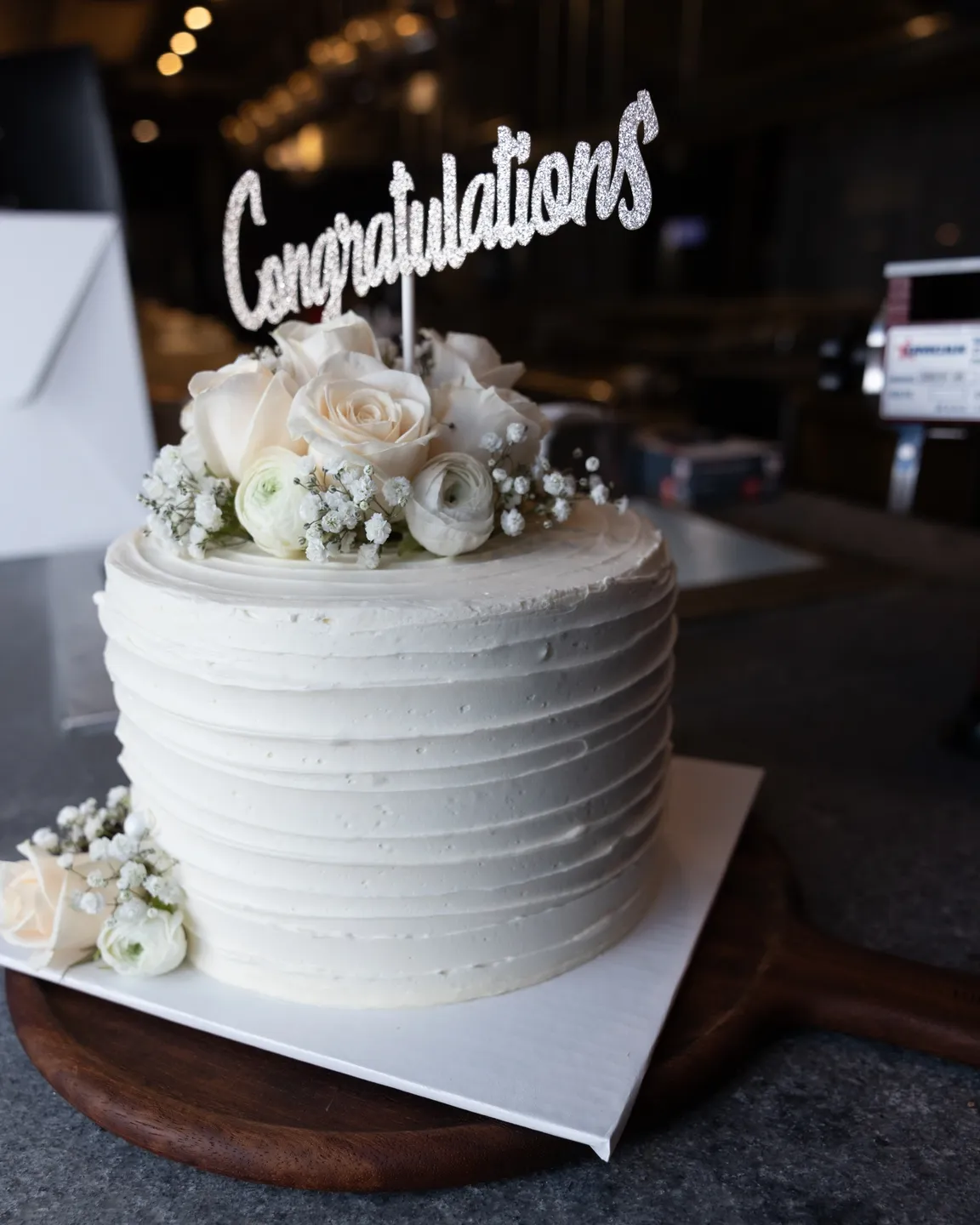 White cake with flowers and 