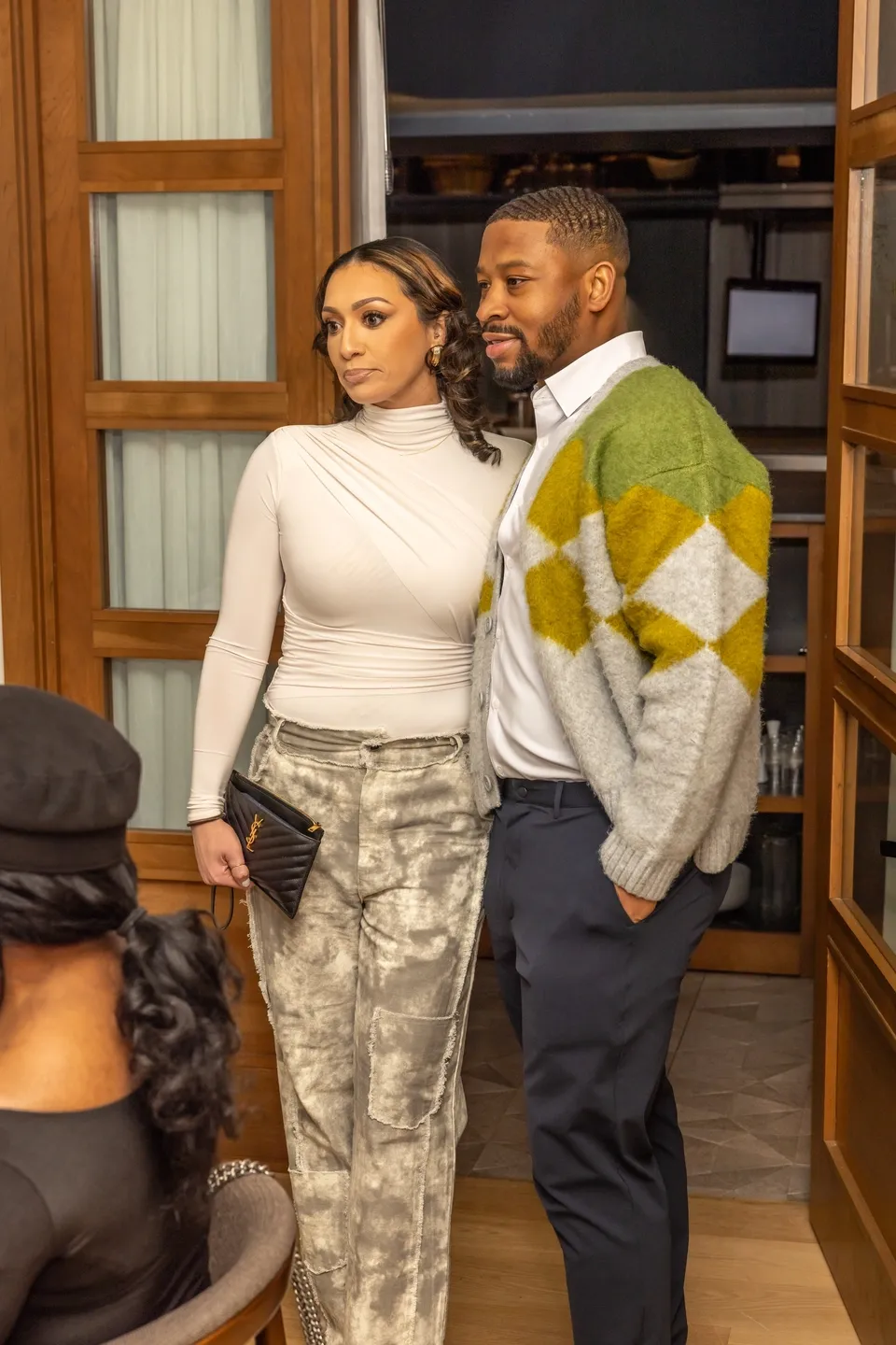 Couple posing in a restaurant.