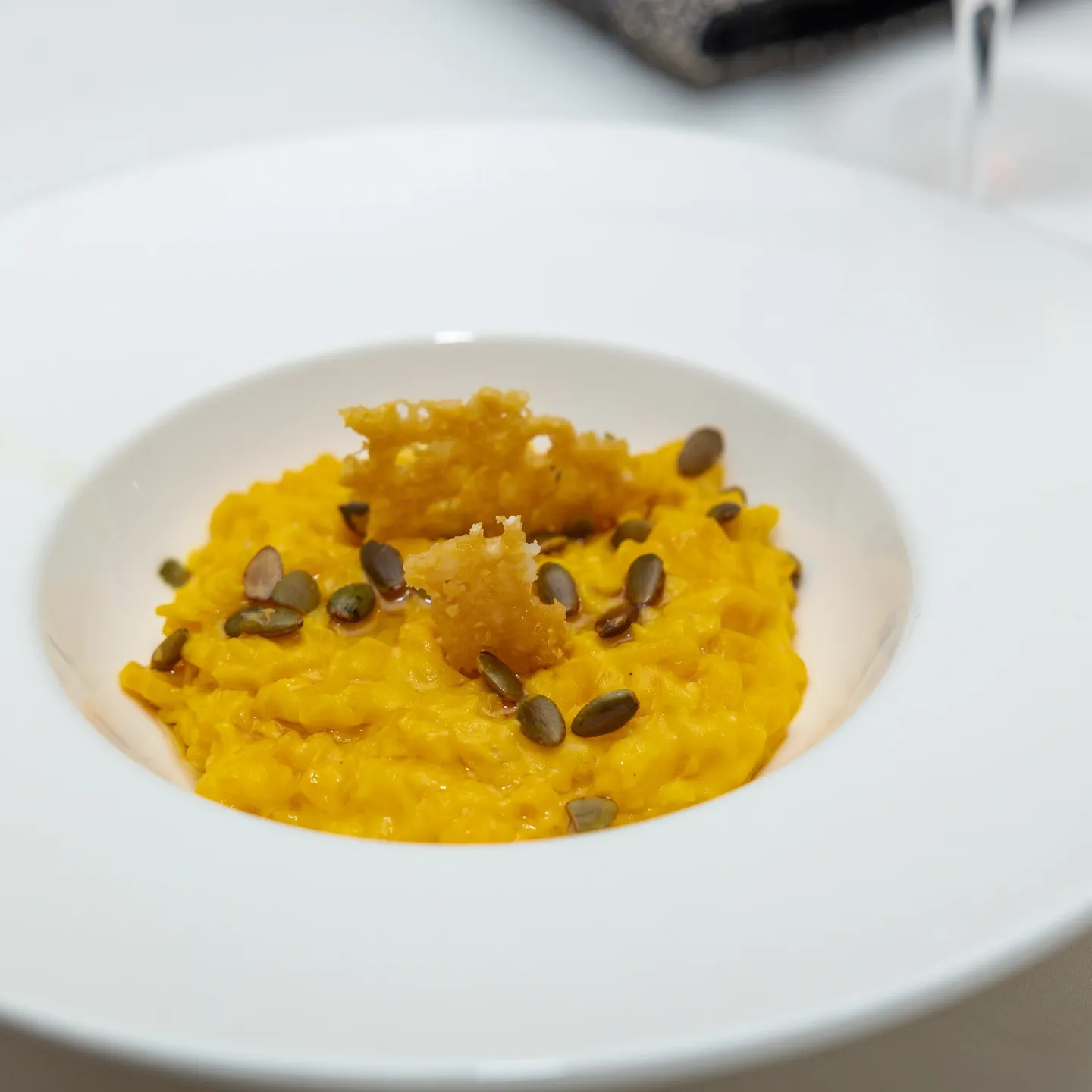 Pumpkin risotto with parmesan and seeds.